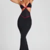 Abito da sera Bella con bordino a contrasto e cut-out in nero Abito da sera Bella con bordino a contrasto e cut-out in nero