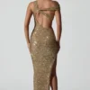 Abito lungo asimmetrico con cut-out e decorazioni Persephone in oro Abito lungo asimmetrico con cut-out e decorazioni Persephone in oro