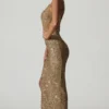 Abito lungo asimmetrico con cut-out e decorazioni Persephone in oro Abito lungo asimmetrico con cut-out e decorazioni Persephone in oro