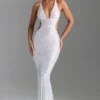Abito lungo con cut-out e decorazioni sulla schiena Magdalena in bianco Abito lungo con cut-out e decorazioni sulla schiena Magdalena in bianco