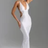 Abito lungo con cut-out e decorazioni sulla schiena Magdalena in bianco Abito lungo con cut-out e decorazioni sulla schiena Magdalena in bianco