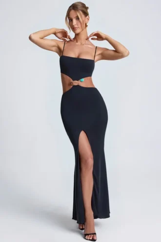 Abito lungo con cut-out e dettagli metallici Julitta in nero Abito lungo con cut-out e dettagli metallici Julitta in nero