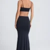 Abito lungo con cut-out e dettagli metallici Julitta in nero Abito lungo con cut-out e dettagli metallici Julitta in nero