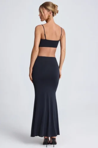 Abito lungo con cut-out e dettagli metallici Julitta in nero Abito lungo con cut-out e dettagli metallici Julitta in nero