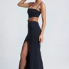 Abito lungo con cut-out e dettagli metallici Julitta in nero Abito lungo con cut-out e dettagli metallici Julitta in nero