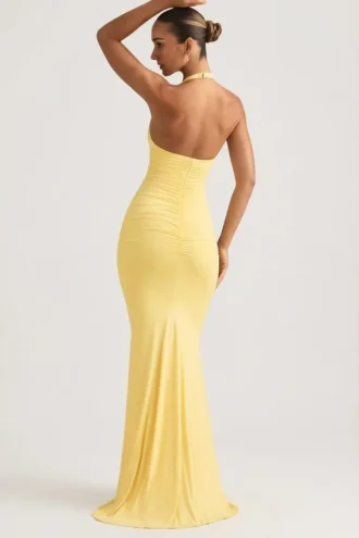 Abito lungo con scollo all’americana e drappeggi sulla schiena Laverna in giallo pastello Abito lungo con scollo all’americana e drappeggi sulla schiena Laverna in giallo pastello