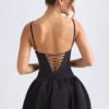 Abito micro mini con corsetto e orlo a palloncino allacciato Anahita in nero