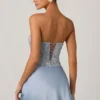 Abito mini drappeggiato senza spalline con decorazioni Eden in azzurro