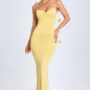 Aldona Abito lungo in jersey elasticizzato con applicazioni floreali in giallo pastello Aldona Abito lungo in jersey elasticizzato con applicazioni floreali in giallo pastello