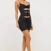 Aniela Vestito corto in jersey elasticizzato con dettagli a rosa e cut-out in nero Aniela Vestito corto in jersey elasticizzato con dettagli a rosa e cut-out in nero