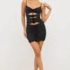 Aniela Vestito corto in jersey elasticizzato con dettagli a rosa e cut-out in nero Aniela Vestito corto in jersey elasticizzato con dettagli a rosa e cut-out in nero