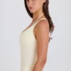 Body a strati con scollo incrociato in jersey di cotone elasticizzato color crema