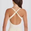 Body a strati con scollo incrociato in jersey di cotone elasticizzato color crema
