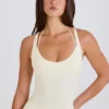 Body a strati con scollo incrociato in jersey di cotone elasticizzato color crema