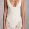 Body Caia in pizzo trasparente con scollo a V smerlato, colore bianco Body Caia in pizzo trasparente con scollo a V smerlato, colore bianco