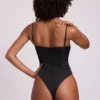 Body corsetto con scollo a V e allacciatura in raso Yelda, nero Body corsetto con scollo a V e allacciatura in raso Yelda, nero
