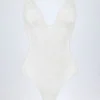 Body Zayla in pizzo trasparente con scollo a V smerlato, colore bianco Body Zayla in pizzo trasparente con scollo a V smerlato, colore bianco