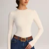Body Ziva in modal a maniche lunghe con scollo rotondo, color crema Body Ziva in modal a maniche lunghe con scollo rotondo, color crema