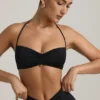 Bralette con scollo all’americana e dettagli metallici in jersey elasticizzato nero Bralette con scollo all’americana e dettagli metallici in jersey elasticizzato nero