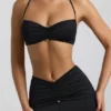 Bralette con scollo all’americana e dettagli metallici in jersey elasticizzato nero Bralette con scollo all’americana e dettagli metallici in jersey elasticizzato nero