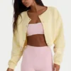 Cardigan corto abbottonato in jersey spazzolato, colore giallo tenue