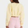 Cardigan corto abbottonato in jersey spazzolato, colore giallo tenue