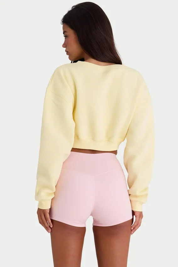 Cardigan corto abbottonato in jersey spazzolato, colore giallo tenue