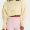 Cardigan corto abbottonato in jersey spazzolato, colore giallo tenue