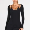 Caris Vestito corto nero con reggiseno allacciato a maniche lunghe in modal a coste Caris Vestito corto nero con reggiseno allacciato a maniche lunghe in modal a coste