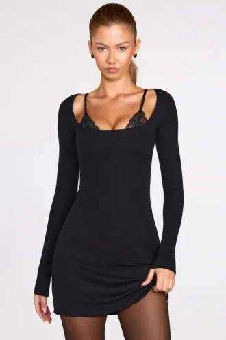Caris Vestito corto nero con reggiseno allacciato a maniche lunghe in modal a coste Caris Vestito corto nero con reggiseno allacciato a maniche lunghe in modal a coste