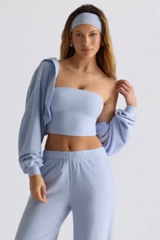 Copri spalle corto con cappuccio in jersey spazzolato, colore blu tenue