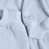 Copri spalle corto con cappuccio in jersey spazzolato, colore blu tenue Copri spalle corto con cappuccio in jersey spazzolato, colore blu tenue