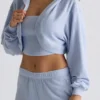 Copri spalle corto con cappuccio in jersey spazzolato, colore blu tenue Copri spalle corto con cappuccio in jersey spazzolato, colore blu tenue
