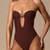 Costume intero a fascia con cut-out Faye in marrone espresso Costume intero a fascia con cut-out Faye in marrone espresso