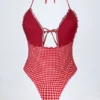 Costume intero con scollo all’americana e cut-out con volant Montjoi in quadretti rossi Costume intero con scollo all’americana e cut-out con volant Montjoi in quadretti rossi