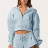 Felpa con cappuccio oversize con zip in blu polvere Felpa con cappuccio oversize con zip in blu polvere
