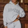Felpa con cappuccio oversize ricamata in grigio melange Felpa con cappuccio oversize ricamata in grigio melange