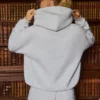 Felpa con cappuccio oversize ricamata in grigio melange Felpa con cappuccio oversize ricamata in grigio melange