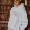 Felpa con cappuccio oversize ricamata in grigio melange Felpa con cappuccio oversize ricamata in grigio melange
