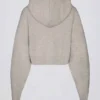 Felpa corta con cappuccio e zip in morbida maglia, color beige Felpa corta con cappuccio e zip in morbida maglia, color beige