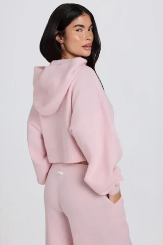 Felpa corta con cappuccio e zip in morbida maglia rosa tenue