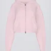 Felpa corta con cappuccio e zip in morbida maglia rosa tenue
