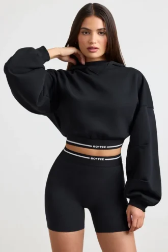 Felpa corta con cappuccio in felpa di cotone elasticizzata, colore nero