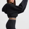 Felpa corta con cappuccio in felpa di cotone elasticizzata, colore nero Felpa corta con cappuccio in felpa di cotone elasticizzata, colore nero
