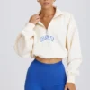 Felpa corta con zip a un quarto in bianco