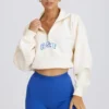 Felpa corta con zip a un quarto in bianco