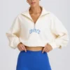 Felpa corta con zip a un quarto in bianco