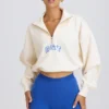 Felpa corta con zip a un quarto in bianco