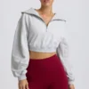 Felpa corta con zip a un quarto in grigio melange
