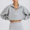 Felpa corta con zip a un quarto in grigio melange